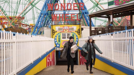 Mabel and Theo running from Glitter person in Coney Island on Only Murders in the Building.
