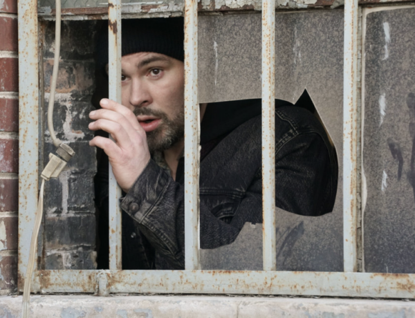 Adam Ruzek looks out the window hoping that this isn't how his life ends on Chicago PD